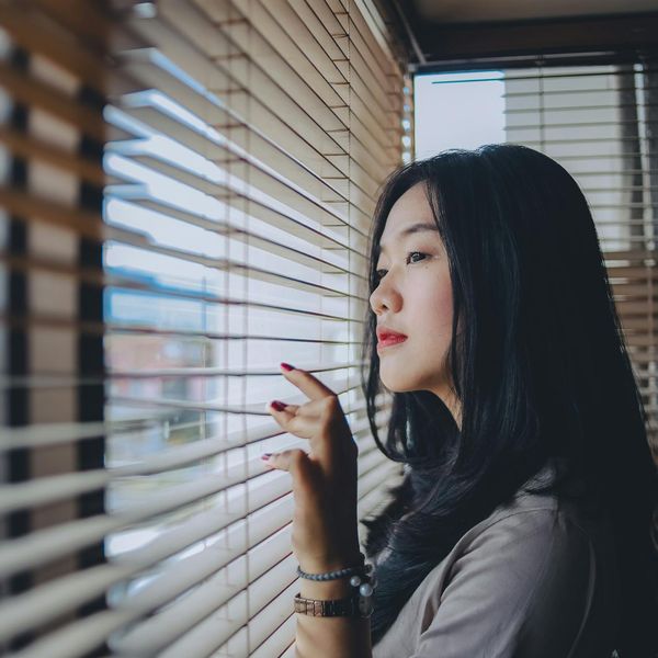 Close-up of a person meditating with a calm expression.